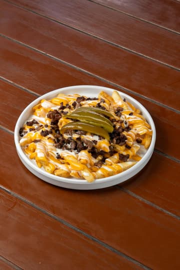 Loaded Cheese Fries with Seasoned Beef and Pickles